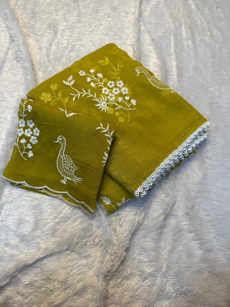 Crunchy chiffon fabric with white figured embroidary work allover saree with beautiful white rich cotton border on it with tone to tone white embroidary work blouse